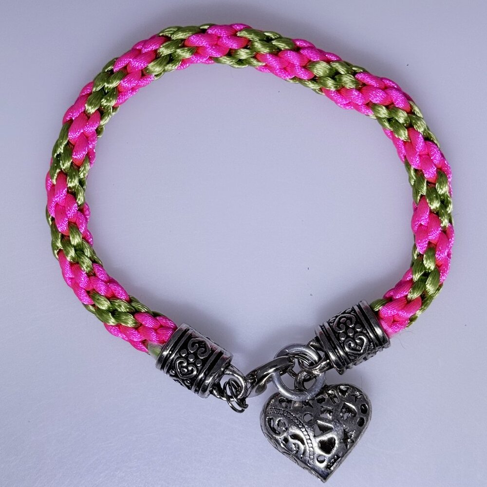 bright colored bracelet, fuchsia and green woven nylon with fancy silver tone
